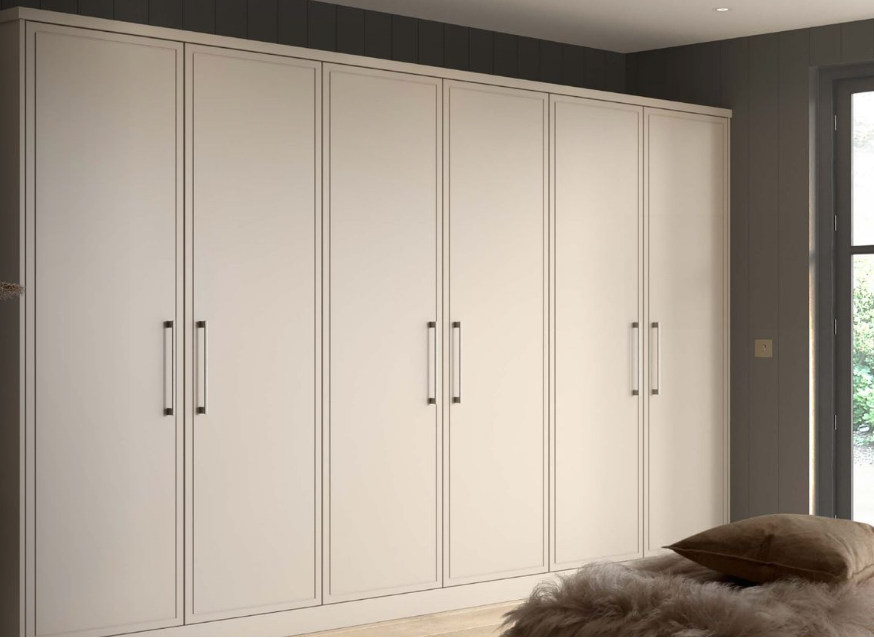 Fitted wardrobes in cashmere with six panelled doors
